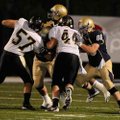 Shiloh Christian senior offensive lineman Josh Salsbury, right, blocks De Queen senior Tyler Reynold...