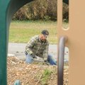 Rory Grams works Tuesday on sidewalks surrounding Gilmore Park in Bentonville. The one-acre park loc...