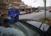 Fred Nickell, Fayetteville parking management officer, checks the vehicle identification number of a car without tags Tuesday. The City Council is beginning discussions about how it will change parking policies in the Dickson Street entertainment district. 
