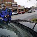 Fred Nickell, Fayetteville parking management officer, checks the vehicle identification number of a...