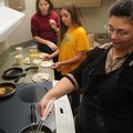 SaraJo Anderson, 13, from left, and Tiffany Brittain, 12, eat the results Tuesday while they learn h...
