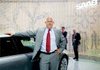 Swedish automobile maker Christian von Koenigsegg poses next to a Saab 9-5 at the Frankfurt Auto Show in this September file photo.