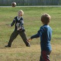 Will Hudspeth (left) and Avery Pitts, both of Fayetteville, play football Tuesday at Happy Hollow Pa...