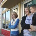 Jolana Gooding, left, and Stacy Wharry, holding Silas Gooding, 2, talk Wednesday in downtown Bentonv...