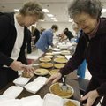 Deanna Haynie (left) and Mary Ann Bennett, both of Rogers, box pieces of pie Wednesday at First Bapt...