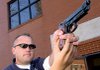 North Little Rock police officer B.T. Carmical, who lost his right hand in an accident in 2002, demonstrates how he uses his left hand and his prosthesis to hold a handgun. 