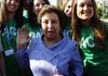 Iranian Nobel peace laureate Shirin Ebadi (center), in selfimposed exile in Italy and accompanied by youths, visits the Scampia district in Secondigliano the outskirts of Naples.