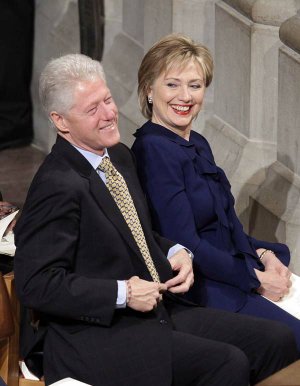 Former President Bill Clinton shares a laugh with his wife, Secretary of State Hillary Rodham Clinton, in January before an inaugural prayer service in Washington, D.C.