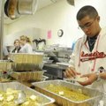 Jose Martinez, right, an Army private stationed at Fort Leonard Wood, Mo., prepares dressing Thursda...