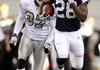 Dallas’ Felix Jones (28) sprints toward the end zone on a 46-yard touchdown run as Oakland’s Chris Johnson gives chase. Jones and fellow running backs Marion Barber and Tashard Choice each ran for more than 60 yards as the Cowboys had their highest offensive output of the season in a 24-7 victory. 