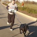 Abrena Rine of Springdale and her dog, Kenyan, gallop toward the finish line Thursday at the annual ...