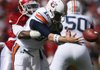 Arkansas' Jerico Nelson hits Auburn quarterback Chris Todd, forcing a fumble Oct. 10 at Donald W. Reynolds Razorback Stadium in Fayetteville. Arkansas won 44-23.