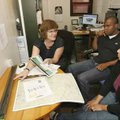 Sonja Hausmann (left), a paleolimnologist at the University of Arkansas at Fayetteville, talks with ...