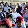 Jon Halbert (center) of Fayetteville participates in the second annual Springdale Police Department ...
