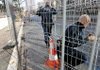 Police officers install fences outside the International Conference Center Geneva in Switzerland on Wednesday in preparation for next week’s World Trade Organization meeting.