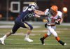 Nashville senior receiver Paul Morrow, right, reaches to fend off Shiloh Christian junior defensive back Jon Hawes during the first quarter Friday in Champions Stadium in Springdale.

