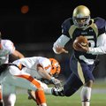 Shiloh Christian quarterback Kiehl Frazier, right, reaches to fend off Nashville defensive back Erin...