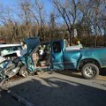 Emergency personnel collect information at the scene of a two-vehicle collision Friday near Dutch Mi...