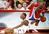 Arkansas junior Jemal Farmer looks to the official in disbelief after being called for a defensive foul against South Alabama sophomore Allyn Cooks (right) during the first half of the Razorbacks' loss Sunday at Bud Walton Arena in Fayetteville.