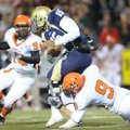 Shiloh Christian quarterback Kiehl Frazier is tackled by Nashville’s Alan Copeland, right, during th...