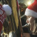 Michelle Biittner, a member of the Bentonville High School Band, plays the tuba Saturday during Tuba...