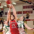 Clarksville guard Serena Clokey, center, reaches for a rebound as Greenland guard Zoe Seay, left, an...
