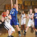 Rogers High forward Elizabeth Ballard pressures West Fork guard Missy Worley during the first half o...