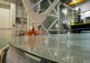 Buddy Martin (left) and Dean Ketelsen of the Steward Observatory Mirror Lab in Tucson, Ariz., inspect a mirror for the Giant Magellan Telescope.