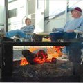 Jean and Royce Johnson of Decatur relax by a campfire Saturday at Horseshoe Bend park on Beaver Lake...