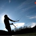 Letting it fly Kelly Mitchell of Centerton enjoys a warm fall day flying a parafoil kite Saturday in...