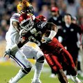 Arkansas tailback Dennis Johnson is tackled by LSU cornerback Patrick Peterson at the end of a big g...
