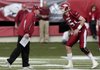 Arkansas Coach Bobby Petrino (left) knows quarterback Ryan Mallett and the rest of the Razorbacks will be playing in a bowl game, but he has no idea about which one.