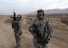 Air Force Tech. Sgt. Phillip Huaser (left) of Salina, Kan., and Georgia National Guardsman Sgt. Scott Millican of Statesboro, Ga., watch as U.S. fighter jets fly overhead Monday near the town of Maidan Shar in Afghanistan’s Wardak province.