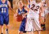 Decatur’s Tiffany Wright, center, looks to shoot as Gravette’s Kaitlynn Britton defends during the first half of Monday’s game in the Benton County Invitational Tournament at Siloam Springs High School.
