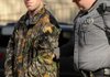 A Benton County Sheriff’s deputy escorts a handcuffed Willie Blackston to a prisoner transport vehicle Monday in Bentonville after Blackston pleaded guilty to second-degree murder. Blackston was charged with causing injuries that resulted in the death of Miguel Barron on Jan. 5, 2008.