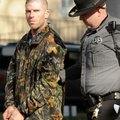 A Benton County Sheriff’s deputy escorts a handcuffed Willie Blackston to a prisoner transport vehic...