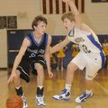 Woodland’s Cameron Paschke dribbles up the court while Central’s Collin Richardson defends during Mo...