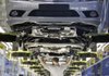 Employees of German carmaker Mercedes-Benz assemble Mercedes C-Class sedans on the production line in Sindelfingen, near Stuttgart, Germany, last year.