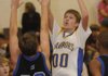 Central’s Alex Rice, left, takes a shot over Woodland’s Chase Carney during Monday’s game in Springdale.