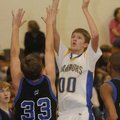 Central’s Alex Rice, left, takes a shot over Woodland’s Chase Carney during Monday’s game in Springd...