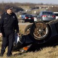 Trooper George Enke with Troop L of the Arkansas State Police examines damage to a 2002 Chevrolet Ca...