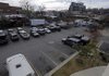 The large public parking lot behind bars and restaurants on Dickson Street is one of several city-owned lots that will eventually charge motorists to park. The Fayetteville City Council began discussing Tuesday three ordinances to transform parking policy in the Dickson Street Entertainment District. 
