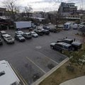 The large public parking lot behind bars and restaurants on Dickson Street is one of several city-ow...