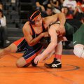 Rogers Heritage’s Francisco Simental, left, tries to gain an advantage over Van Buren’s Michael Coli...