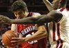 Arkansas forward Michael Sanchez, left, drives to the basket as Oklahoma guard Willie Warren defends in the first half of the Razorbacks' 67-47 loss in Norman, Okla., on Wednesday.