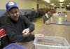 Brent Koci works Wednesday at the Adult Development Center in Siloam Springs. Siloam Springs may cut funding for nonprofit groups such as the Adult Development Center. Brad DeZurk, administrator of the center, said he understands the economic problems and is thankful for all the support the city has given to the center.
