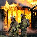 Rogers Fire Department Capt. Rob Taylor, right, and firefighter Pete Melnicki wait for water to be s...