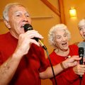 Winston Harvey (left) and Rosanna Falk, both of Fayetteville, and Margie Lunsford of Johnson sing We...