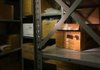 The bones of a young girl found in 1991 in woods off Archwood Park Road lie in a battered cardboard box (at right) in the state medical examiner’s basement “bone room.” The bones remained undisturbed in the storage closet, located at the west Little Rock state Crime Laboratory, for more than a decade. 