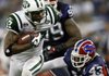 New York wide receiver Braylon Edwards (left) gets past Buffalo’s Bryan Scott (43) in the second quarter of the Jets’ 19-13 victory over the Bills on Thursday night in Toronto.